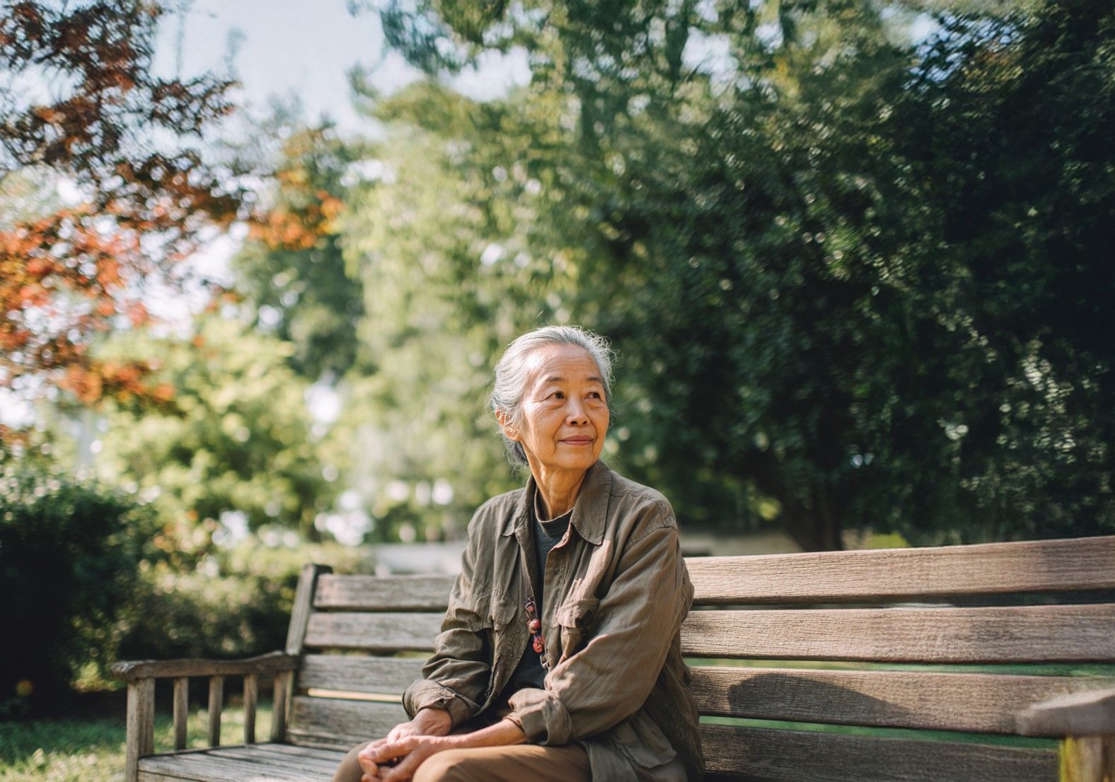 Woman sitting on park bench